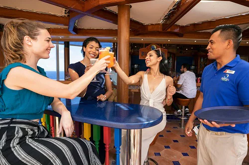 three friends getting together for a drink at blueiguana tequila bar