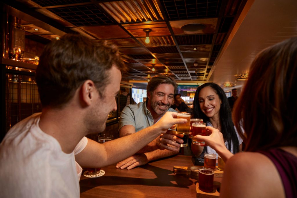 Carnival guests enjoying drinks at the Pig and Anchor Brewery